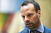 Portrett av Jon Engen-Helgheim i dress under et pressetreff på Stortinget.